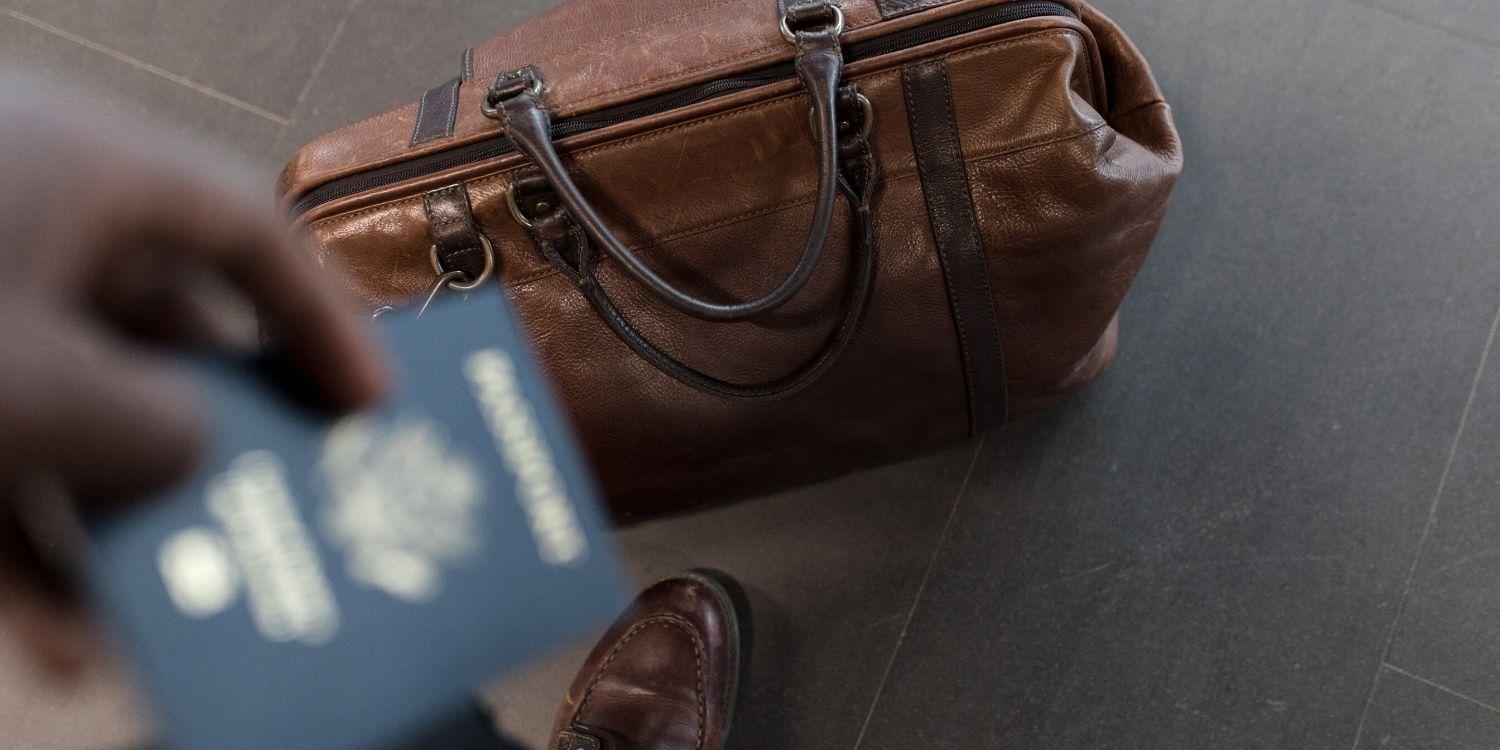 hand_luggage_and_out_of_focus_passport